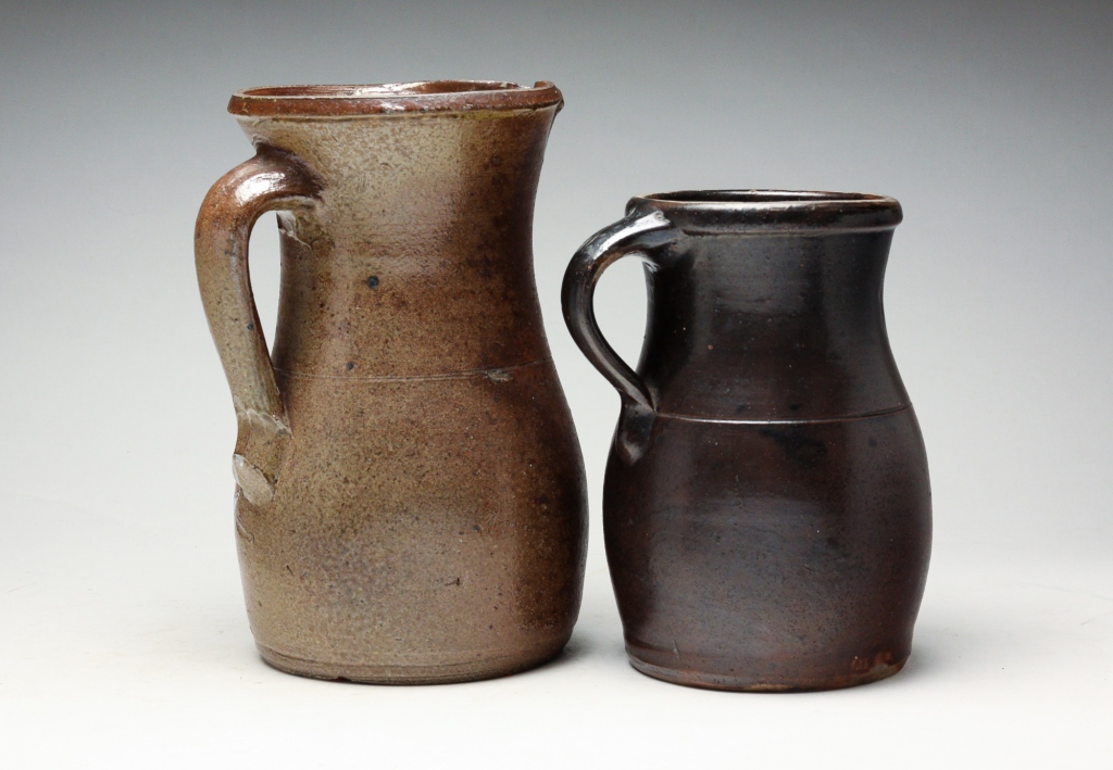 Appraisal: TWO AMERICAN STONEWARE PITCHERS Second half th century Applied strap