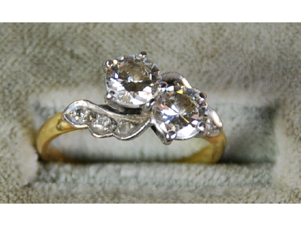 Appraisal: ct GOLD CROSS OVER RING set with two diamonds each