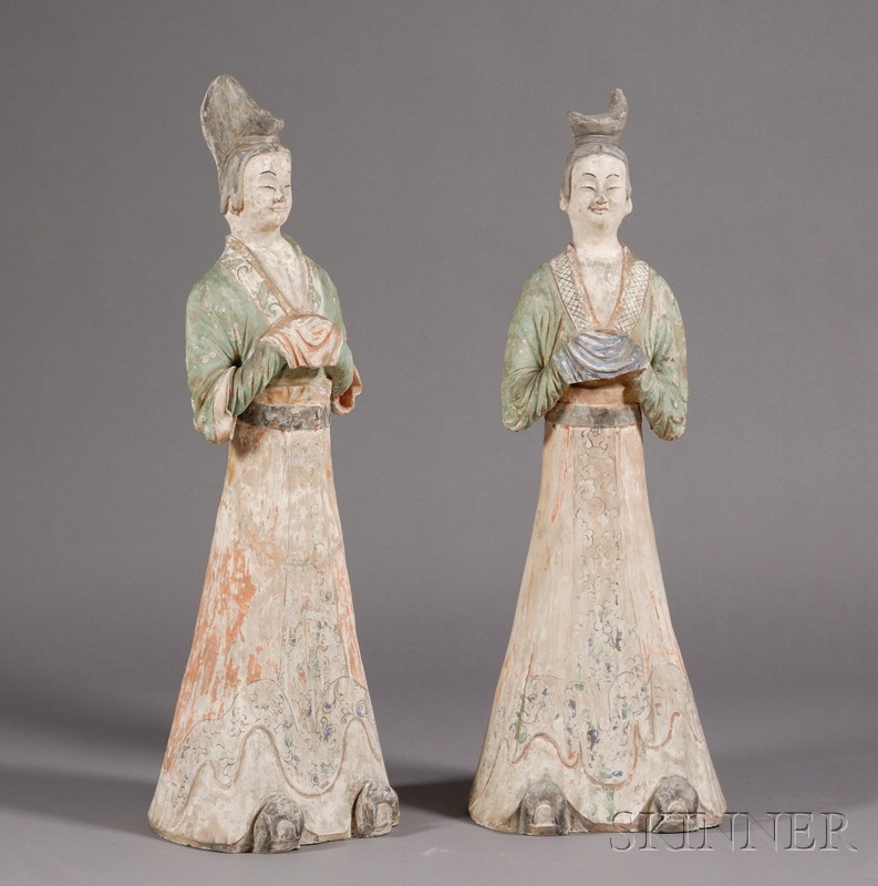 Appraisal: Pair of Pottery Figures China Tang style standing figures of