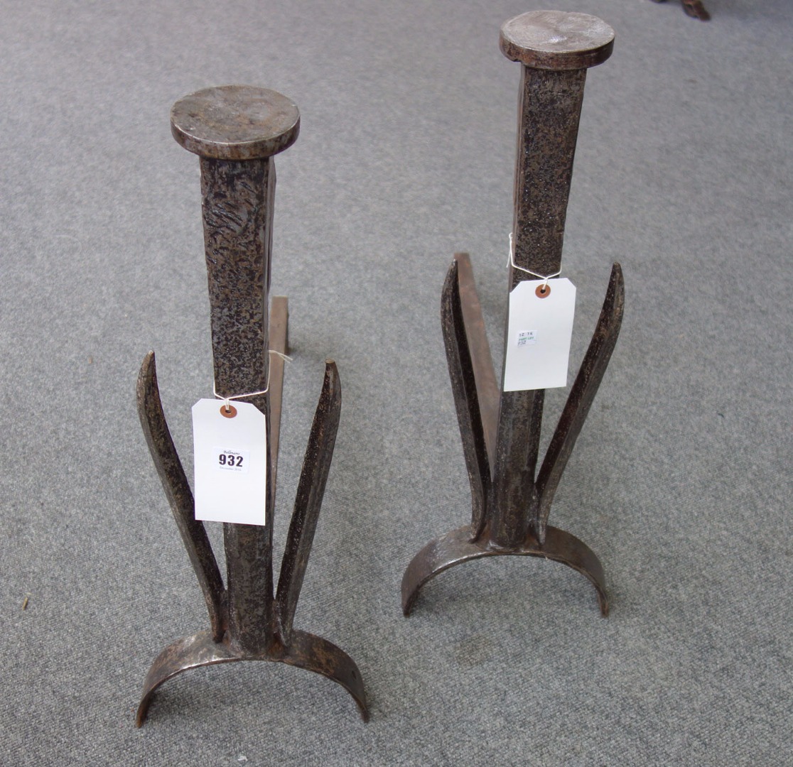 Appraisal: A pair of steel andirons of chamfered form with disc