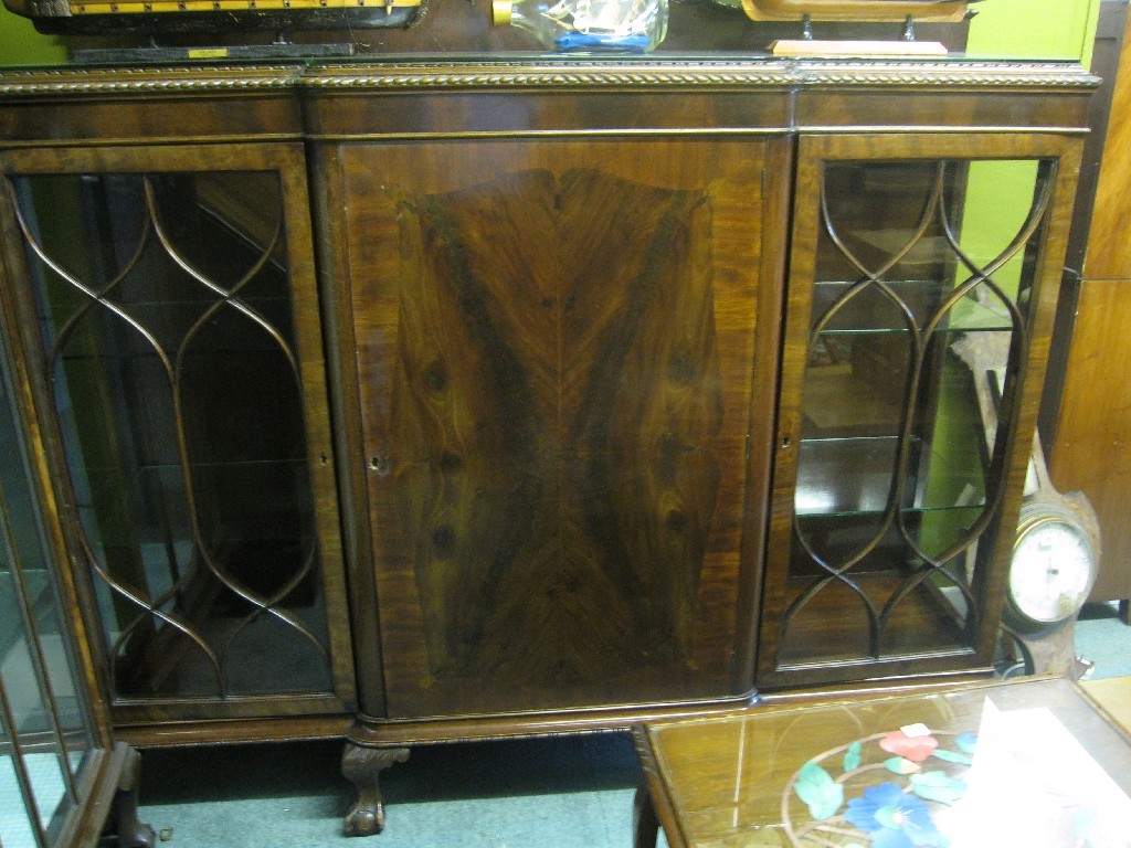 Appraisal: Mahogany break front display cabinet on ball and claw feet