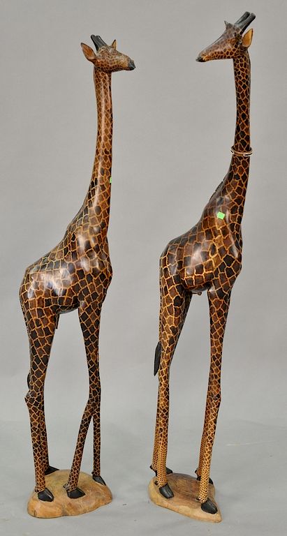 Appraisal: Two large carved wood giraffes height inches and inches Two