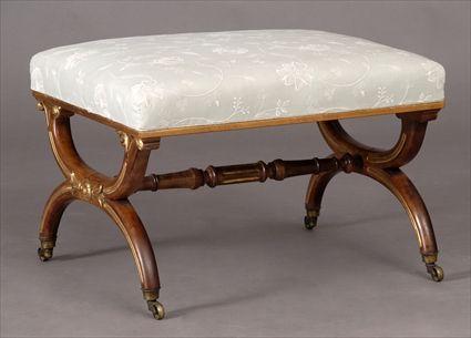 Appraisal: REGENCY CARVED MAHOGANY AND PARCEL-GILT CURULE STOOL The rectangular seat