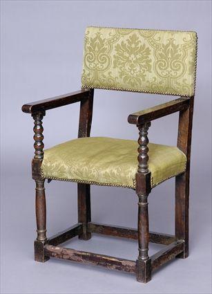 Appraisal: CONTINENTAL BAROQUE-STYLE WALNUT OPEN ARMCHAIR With padded back and seat