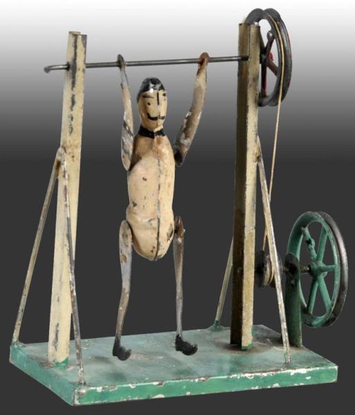 Appraisal: German Made Trapeze Acrobat Description Handpainted steam accessories Condition Very