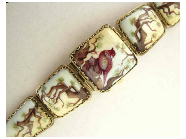 Appraisal: Yanka lady's watch bracelet and face cover with bird-motif painted