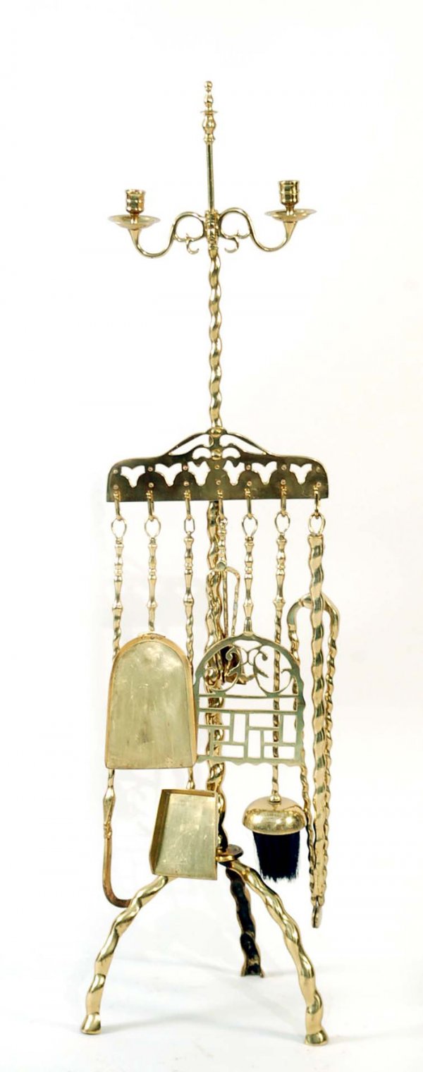 Appraisal: A brass spiral twist Flemish stand with candle holder th