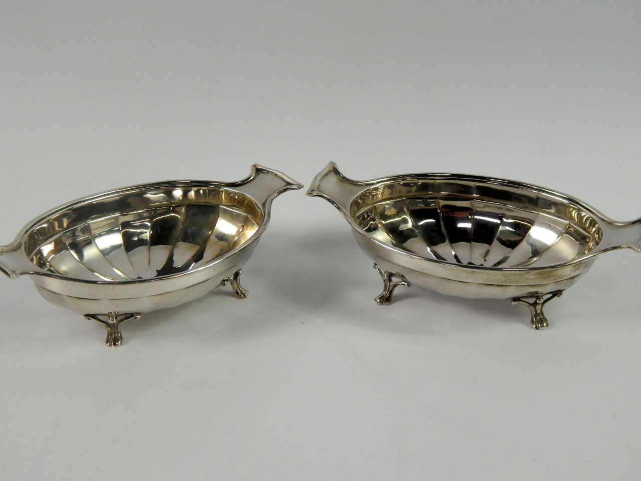 Appraisal: A pair of George V silver twin handle semi fluted