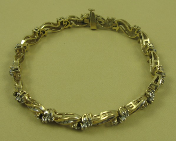 Appraisal: DIAMOND AND TEN KARAT GOLD BRACELET in length and set