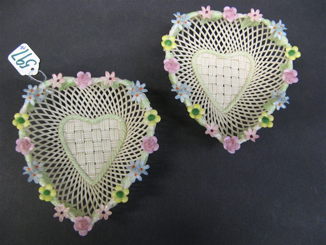 Appraisal: PAIR OF HEART-SHAPED IRISH BELLEEK BASKETS strand single pad with