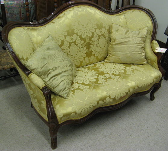 Appraisal: A VICTORIAN SERPENTINE-BACK SOFA Rococo Revival design American c having