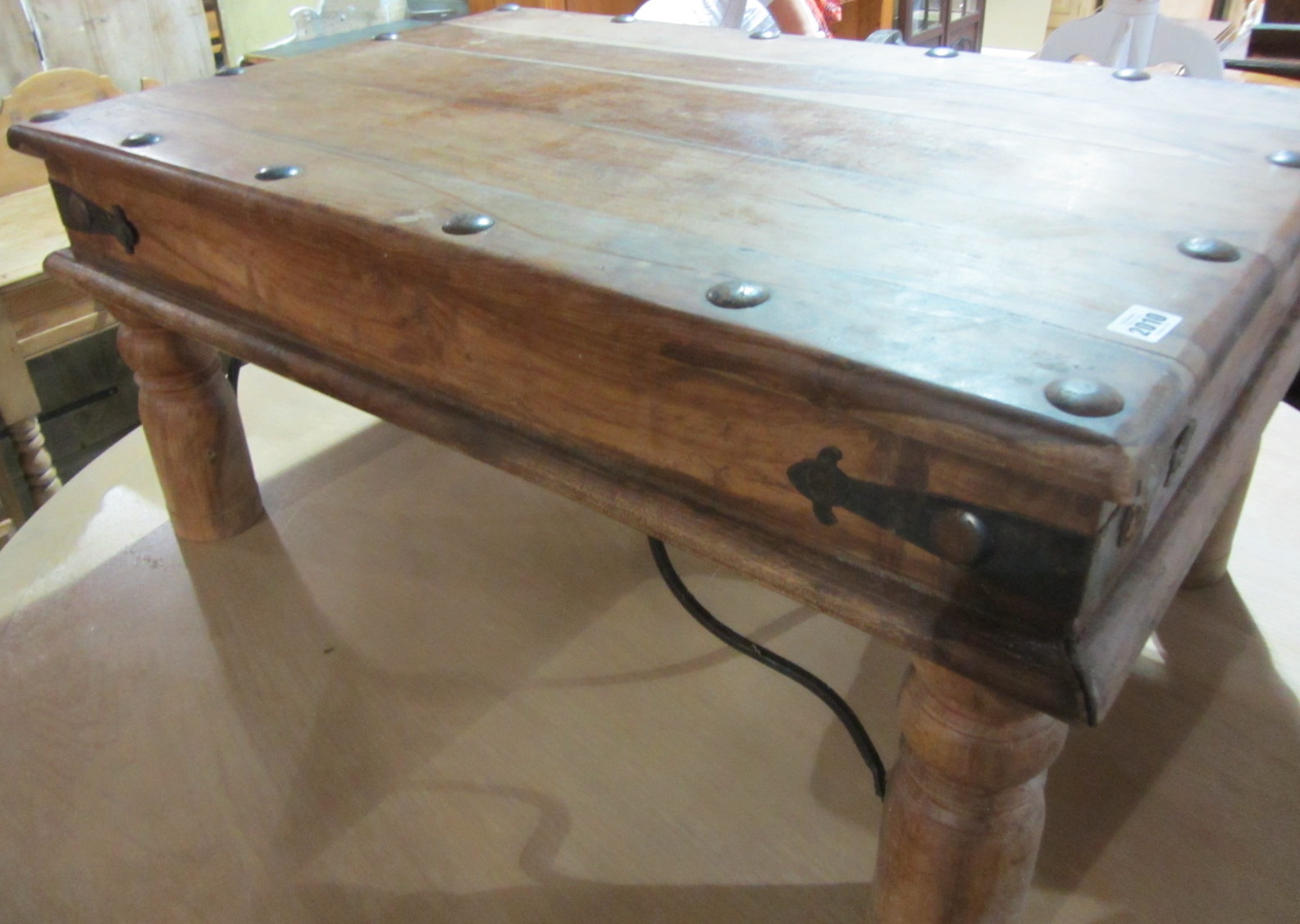 Appraisal: A th century hardwood and iron coffee table