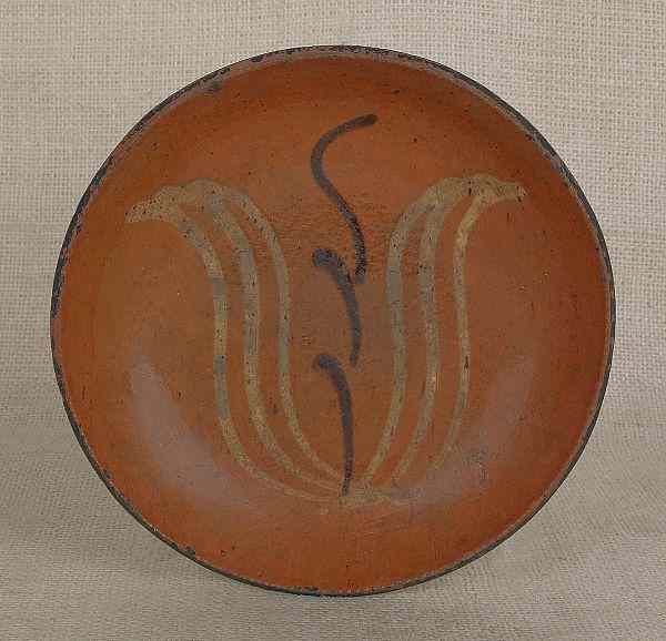 Appraisal: Pennsylvania redware pie plate th c probably Dryville with yellow