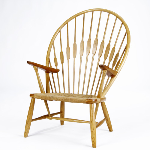 Appraisal: HANS WEGNER JOHANNES HANSEN Oak Peacock chair with teak armrests