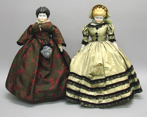 Appraisal: Pair of china Lowbrow dolls With black hair original cloth