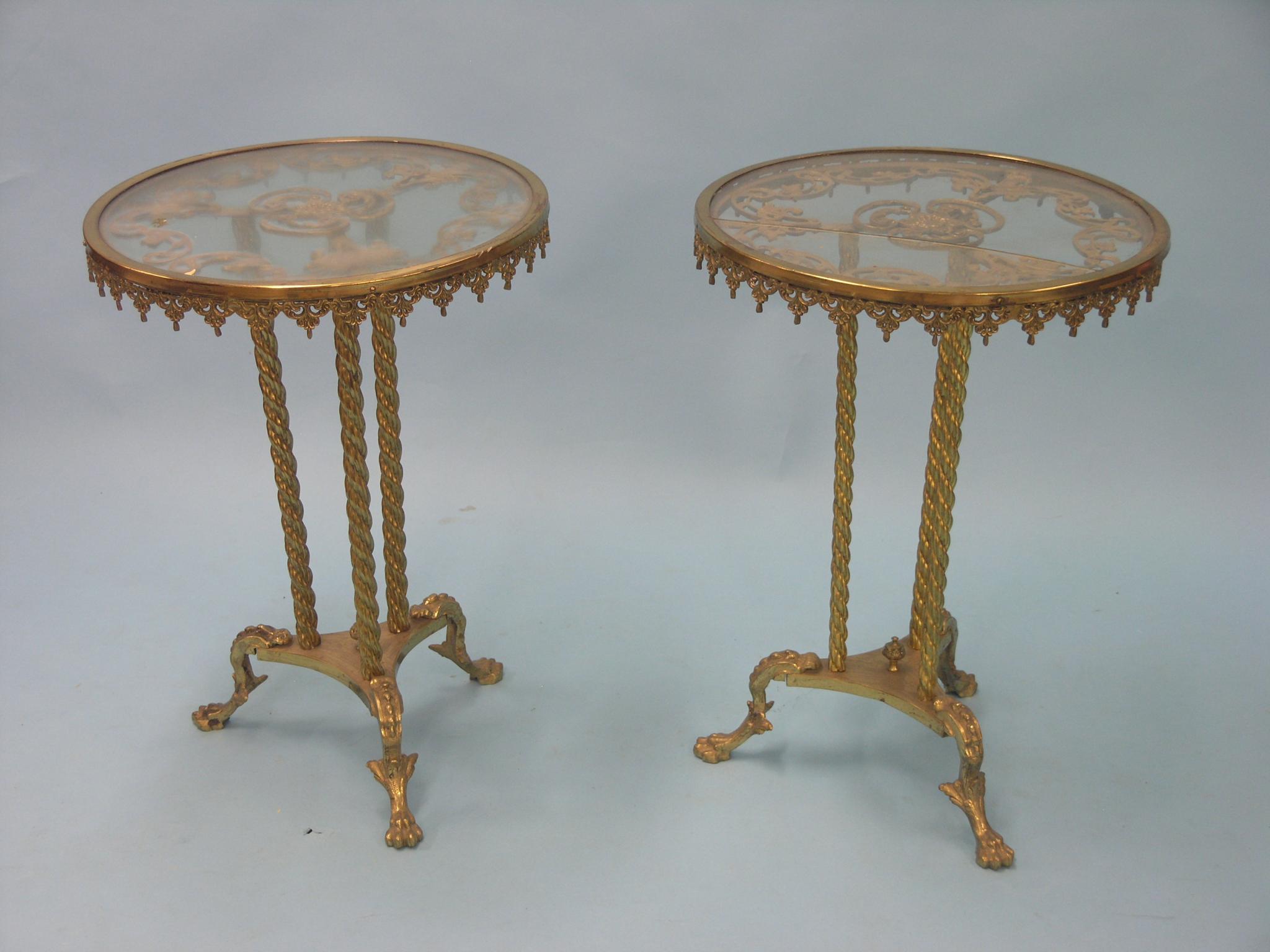 Appraisal: A pair of brass occasional tables circular-shape with glass tops