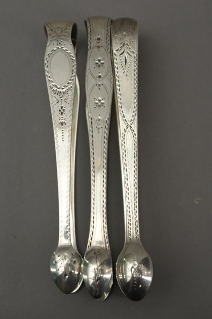 Appraisal: A pair of bright cut sterling silver sugar tongs by