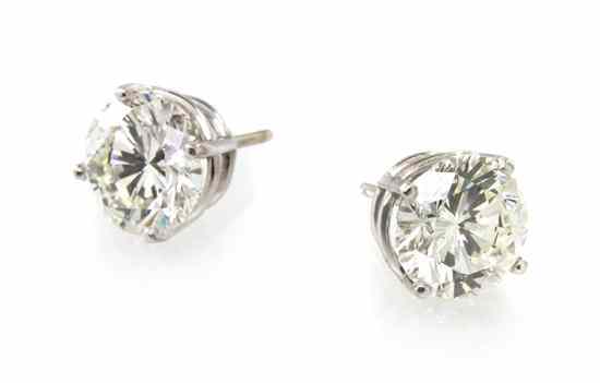 Appraisal: A Pair of Platinum and Diamond Stud Earrings containing one