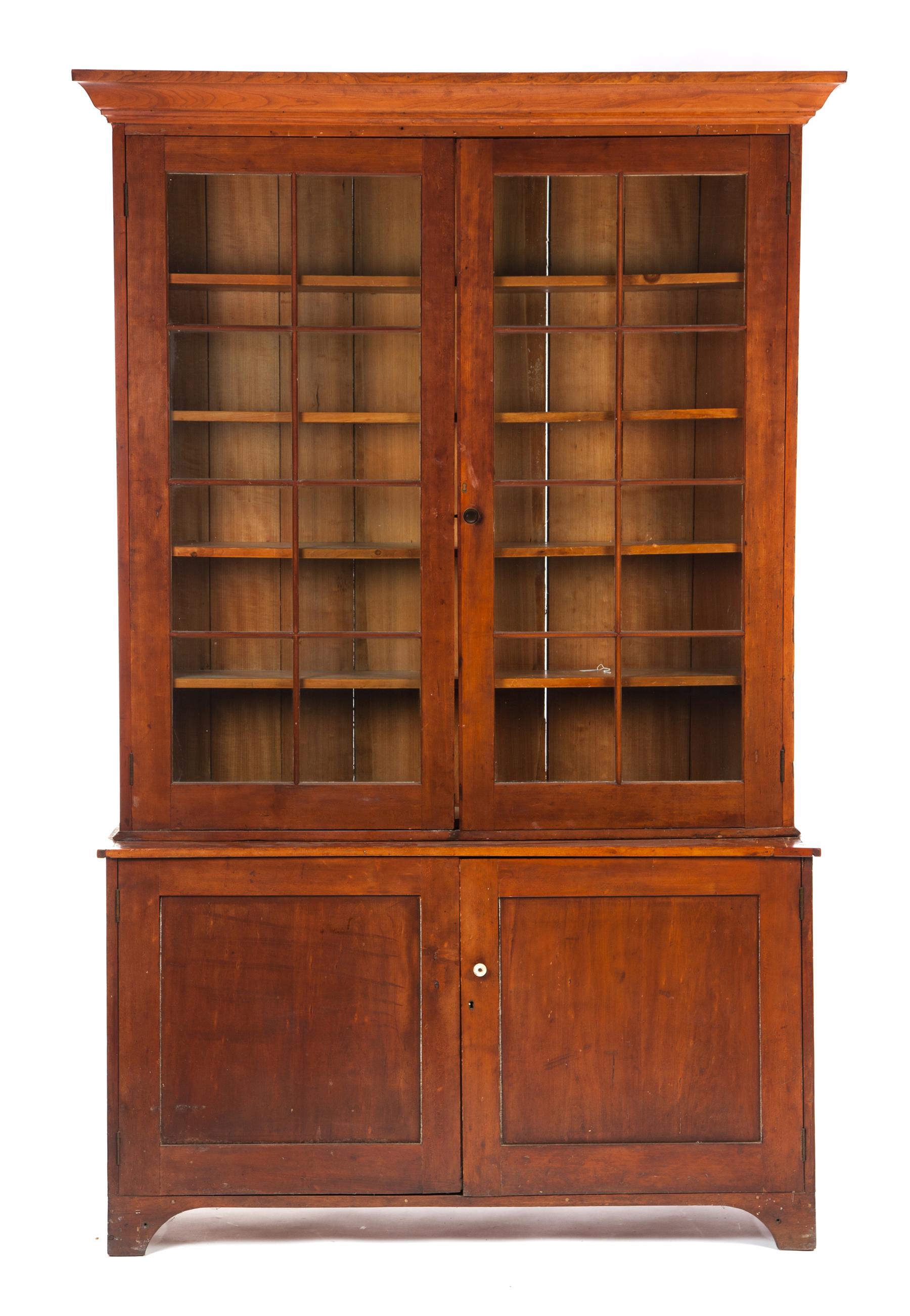 Appraisal: COUNTRY SHERATON TWO-PIECE STEPBACK BOOKCASE American nd quartrer- th century