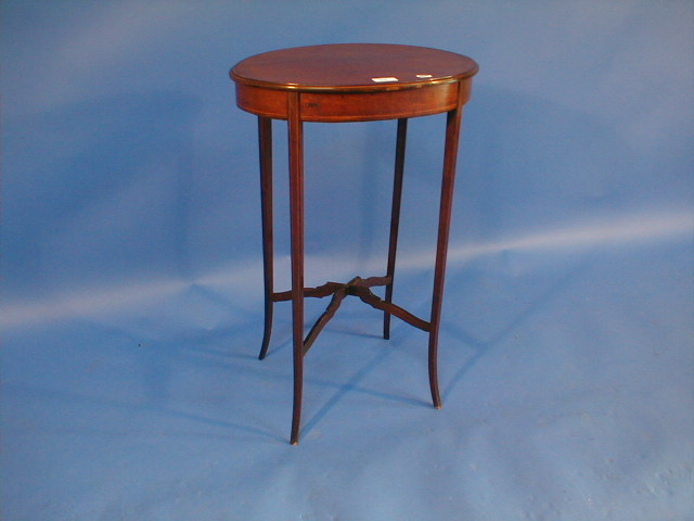 Appraisal: An Edwardian string inlaid mahogany oval occasional table