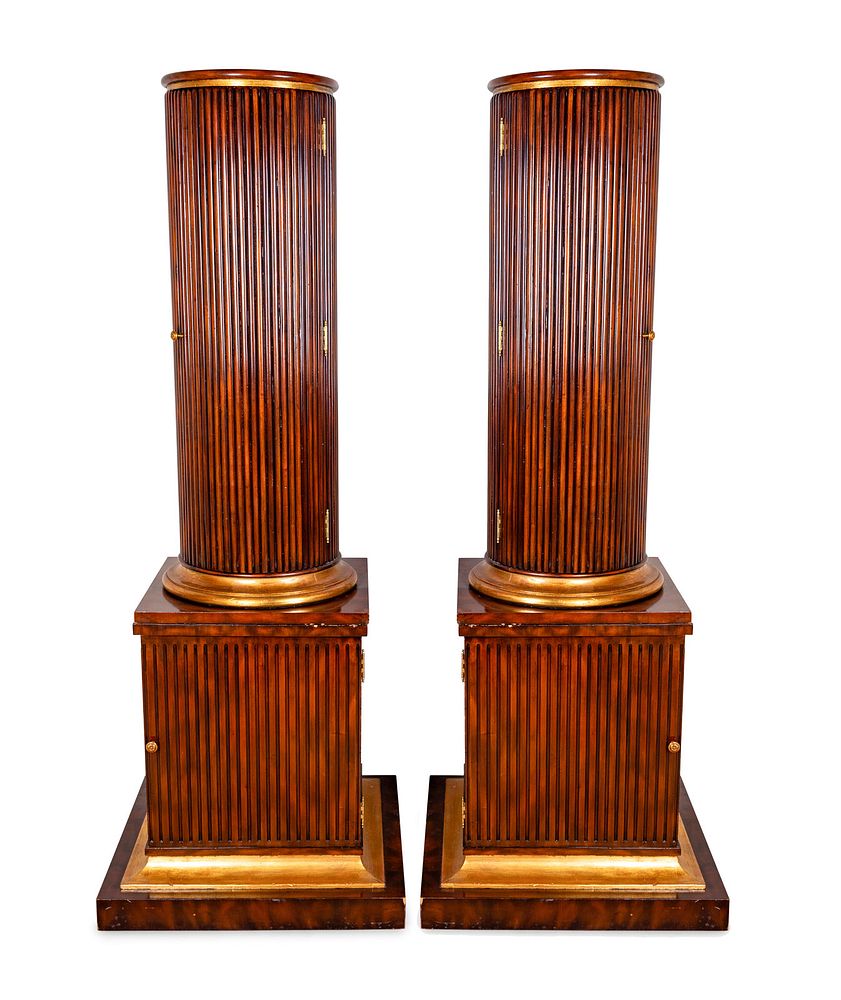 Appraisal: A Pair of Regency Style Fluted Mahogany Columnar CabinetsHeight x