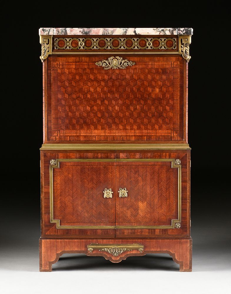 Appraisal: A LOUIS XVI STYLE MARBLE TOPPED AND BRONZE MOUNTED TULIPWOOD