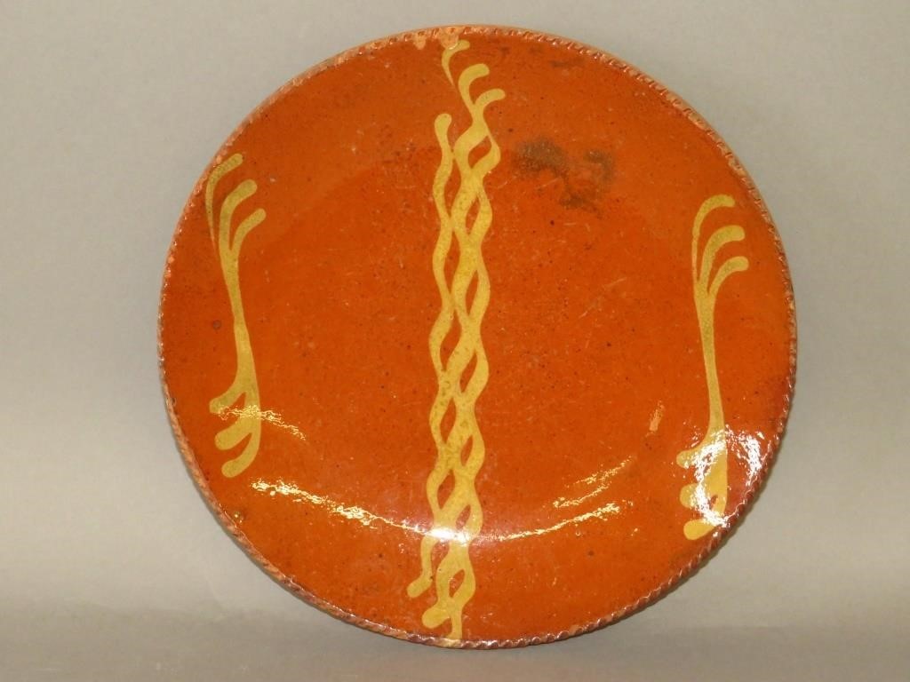 Appraisal: PA SLIPWARE PLATEca PA slipware drape molded plate with three