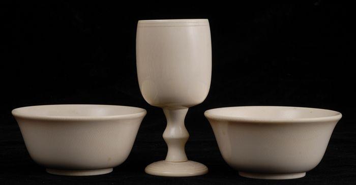 Appraisal: TWO IVORY BELL-FORM FOOTED RICE BOWLS AND A STEMMED GOBLET