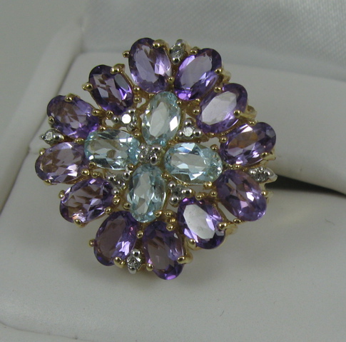 Appraisal: AMETHYST TOPAZ DIAMOND AND FOURTEEN KARAT GOLD RING set with