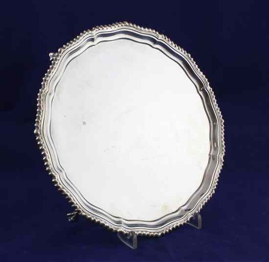 Appraisal: A 's silver shaped circular salver with gadrooned rim on