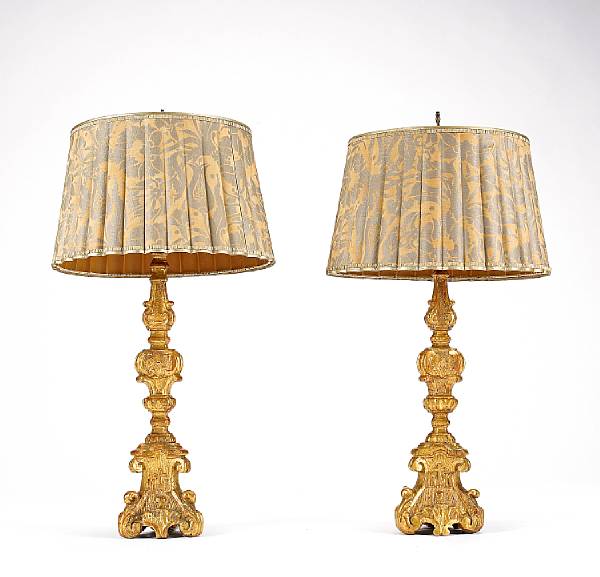 Appraisal: A pair of Northern Italian giltwood pricket sticks now as