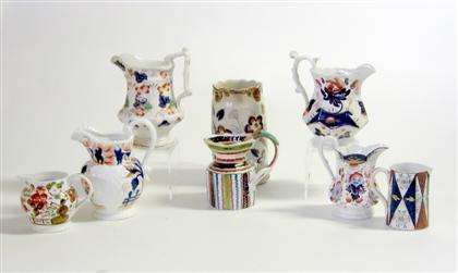 Appraisal: Collection of Gaudy Welsh pitchers and creamers England Decorated with