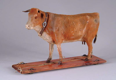 Appraisal: COW ON WHEELED PLATFORM Early th century this cow is