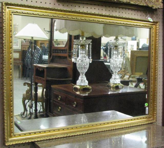 Appraisal: A framed decorator wall mirror antique gold finish frame x