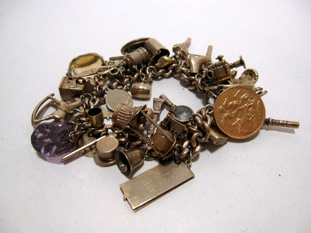 Appraisal: Nine carat gold charm bracelet with various gold charms to