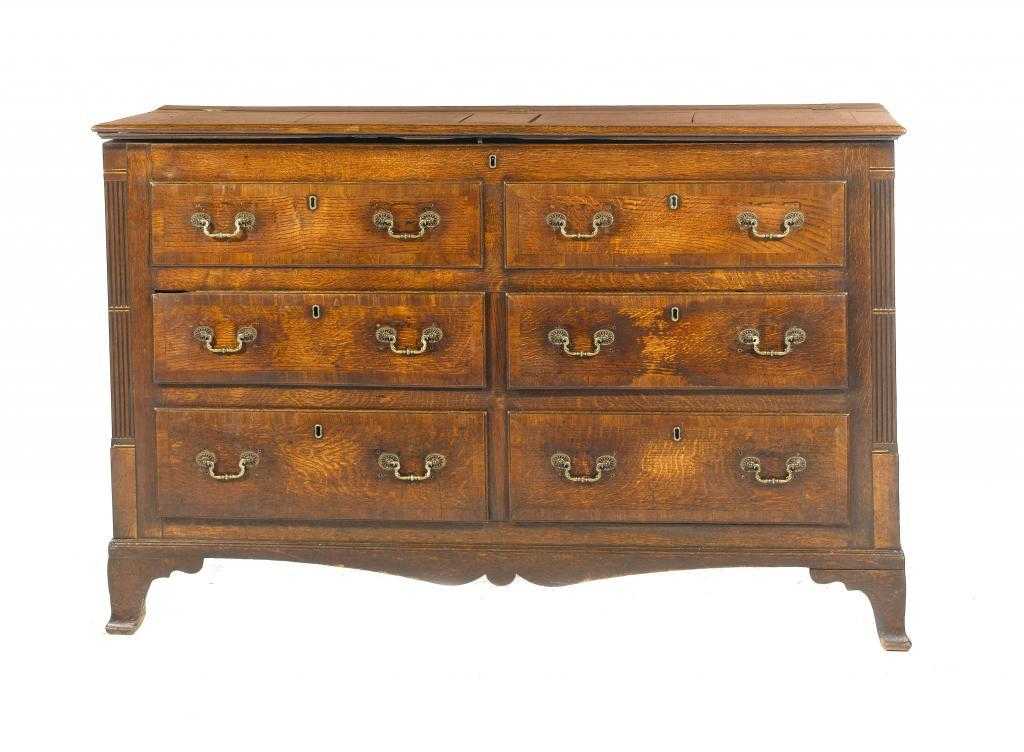 Appraisal: A GEORGE III OAK AND CROSSBANDED LANCASHIRE CHEST with panelled