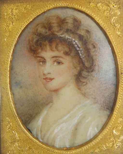 Appraisal: AN OVAL MINIATURE PORTRAIT of a young woman in gilt