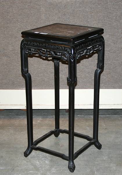 Appraisal: A Chinese carved hardwood vase stand with variegated marble top