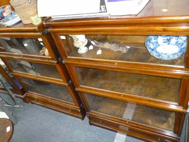 Appraisal: TWO GLOBE WERNICKE STYLE THREE SECTION BOOKCASES each with three