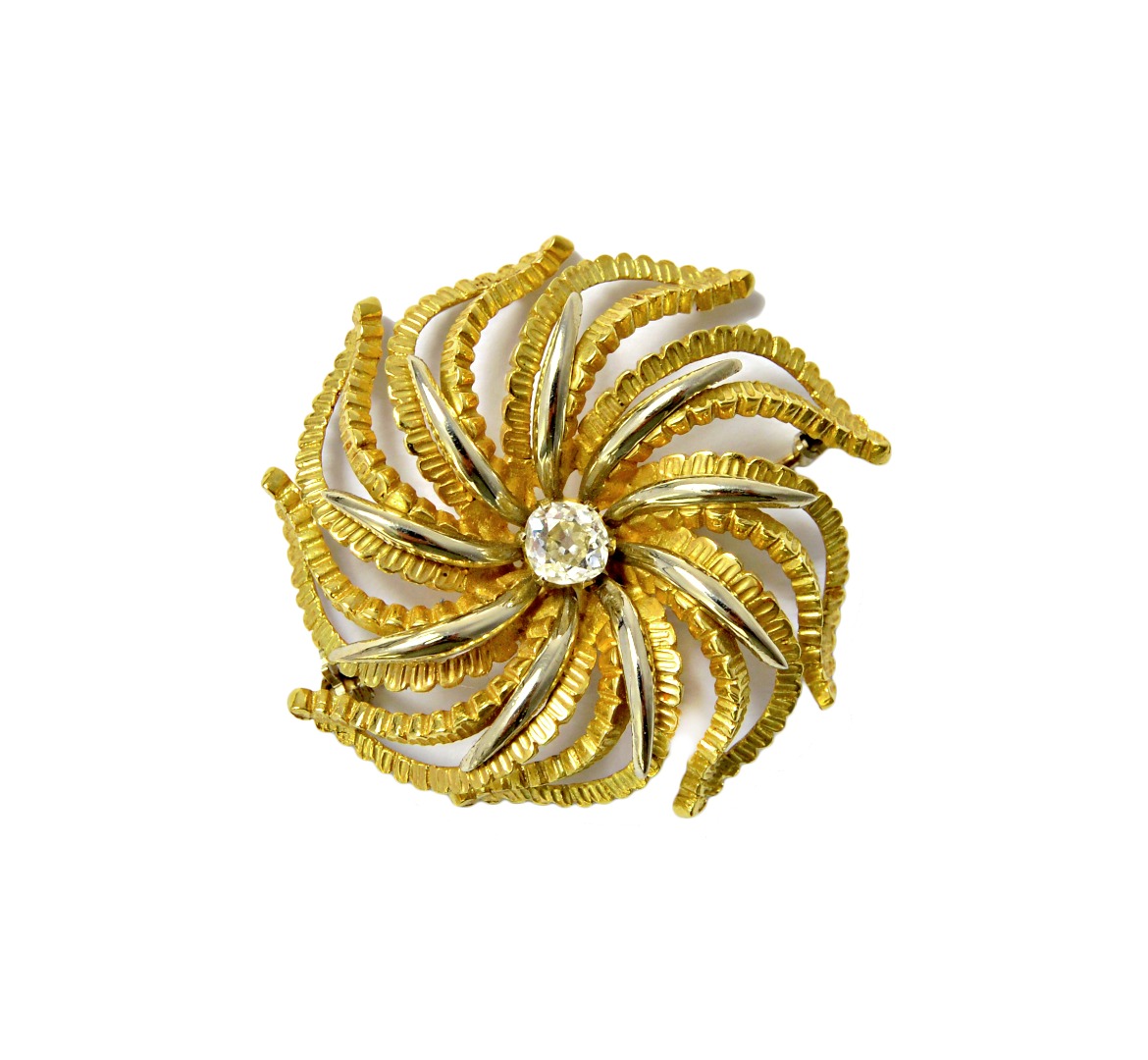 Appraisal: A two colour gold brooch claw set with a cushion