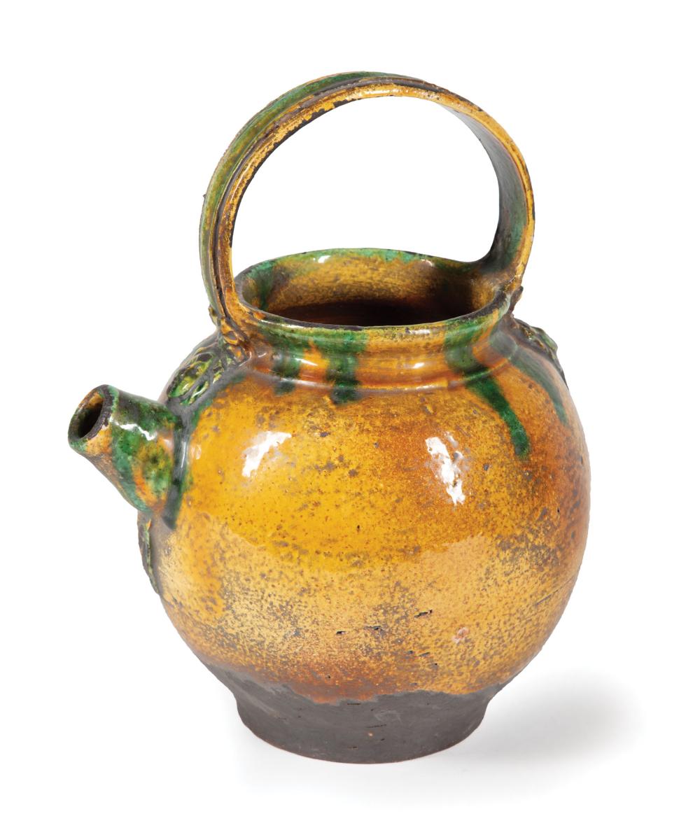 Appraisal: Continental Green and Amber Glazed Pottery Pitcher wide strap handle