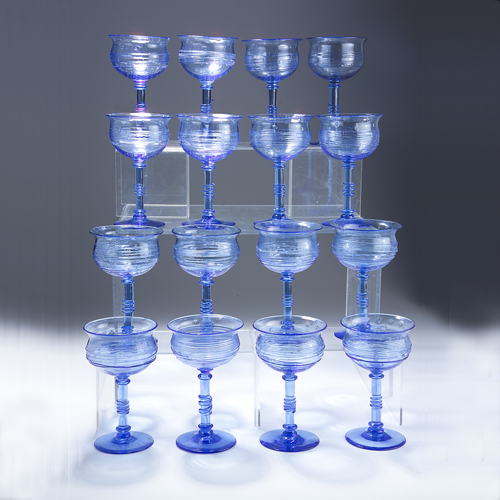 Appraisal: STEUBEN Rare set of sixteen goblets in blue bubbled glass