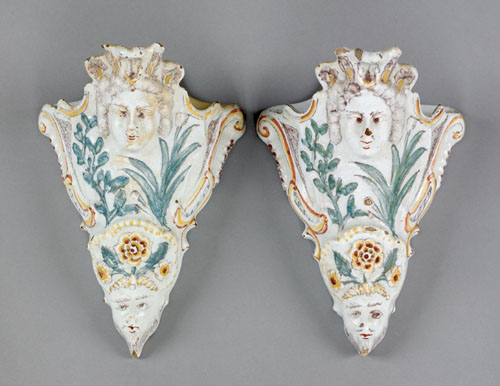 Appraisal: Pair of faience wall pockets th c with mask and