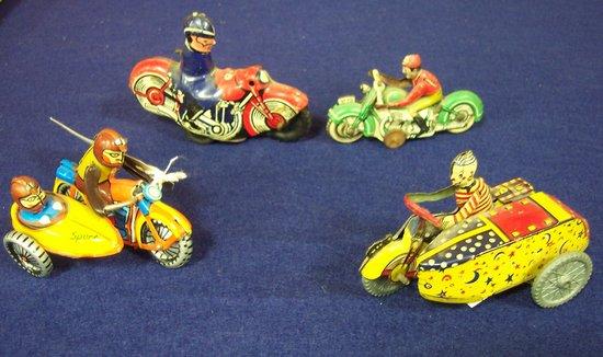 Appraisal: A tinplate motorcycle and side car another and two motorcycles