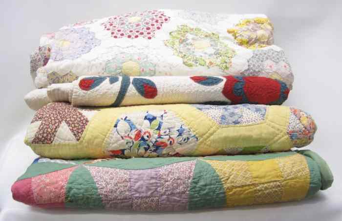 Appraisal: FOUR AMERICAN PATCHWORK QUILTS various patterns hand and machine stitched