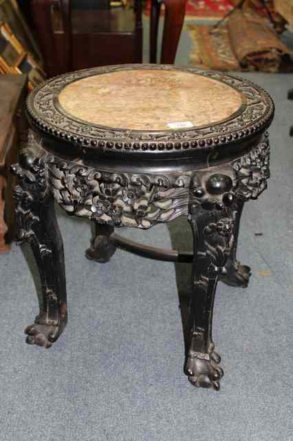 Appraisal: A TH CENTURY PADOUK CHINESE URN STAND the circular top