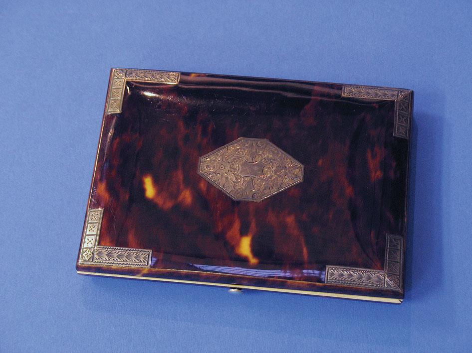 Appraisal: AN ART DECO STYLE TORTOISESHELL AND SILVER MOUNTED CARD CASE