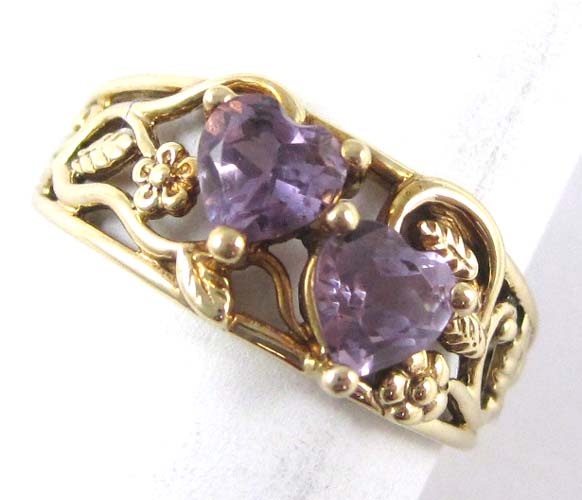 Appraisal: AMETHYST AND TEN KARAT GOLD RING set with two heart-cut