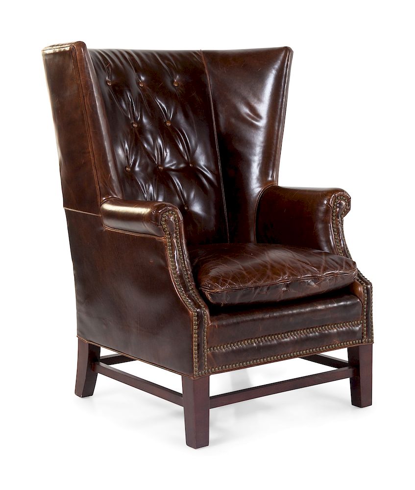 Appraisal: A Leather-Upholstered Wingback Club Chair A Leather-Upholstered Wingback Club Chair