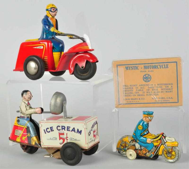 Appraisal: Lot of Tin Litho Vehicle Wind-Up Toys American Includes one